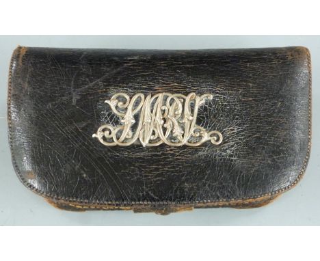 Antique .577 leather bound metal ammunition pouch with silver Middlesex Regiment badge, 18.5x10.5cm.&nbsp;