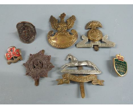Military badges including plastic A. Stanley and Sons, Walsall Royal Army Service Corps, West Yorkshire and Lancashire Fusili