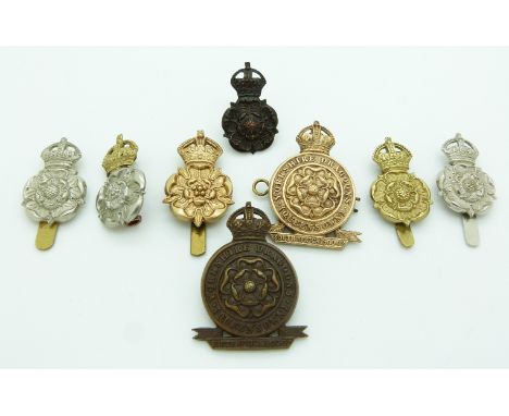 Eight British Army Queen's Own Yorkshire Dragoons metal badges including an officer's example