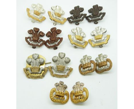 Fourteen British Army South Lancashire Regiment (The Prince of Wales Volunteers) metal collar badges in seven pairs, pre and 