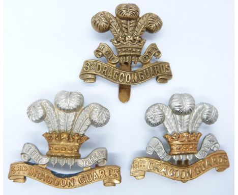 Three British Army 3rd Dragoon Guards metal badges including an all brass example