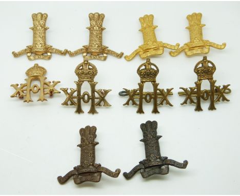 Ten British Army 11th and 20th Hussars metal collar badges in four pairs plus two, one with J R Gaunt of London maker's mark