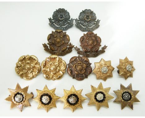 Fourteen British Army East Lancashire Regiment and East Yorkshire Regiment metal collar badges in four pairs plus four, two m