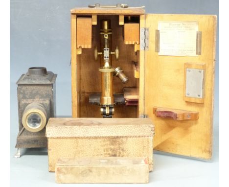 E.Leitz Wetzlar brass microscope with extra eyepiece, in original wooden carry case together with a Bing magic lantern marked