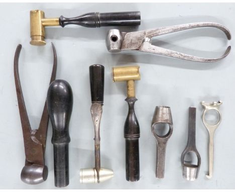 Nine gun or shooting tools and accessories including powder measures, wad punches, bullet moulds, shotgun cartridge extractor