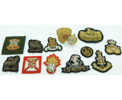 Twelve British Army Gloucestershire Regiment, Green Howards Regiment, Dorsetshire Regiment etc bullion badges including a pai