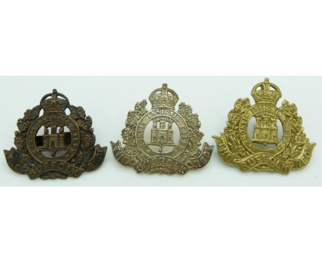Three British Army Suffolk Regiment metal cap badges including a white metal example with Gaunt makers to reverse