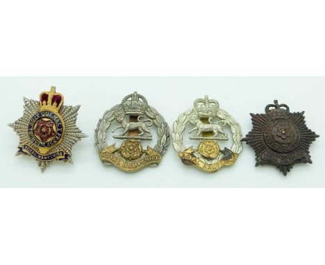 Four British Army Royal Hampshire Regiment metal cap badges including an officer's enamel example