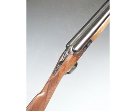 Browning 12 bore side by side ejector shotgun with engraved lock, thumb lever, underside and trigger guard, chequered grip an