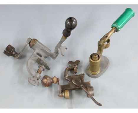 Three shotgun cartridge reloading tools comprising two 12 bore rollover tools, one stamped with H N either side of an anchor,