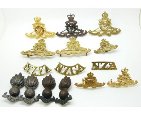 Fifteen New Zealand Army Artillery metal cap badges, collar badges and shoulder titles including a pair of Field Artillery co