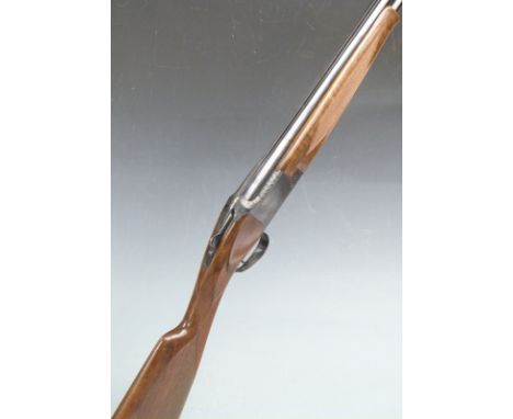 Browning 12 bore over and under ejector shotgun with border engraved locks, underside and trigger guard, chequered grip and f
