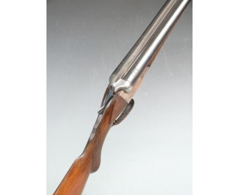 Geco 12 bore side by side shotgun with engraved lock, chequered semi-pistol grip and forend, raised cheek piece, sling suspen