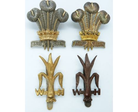 Four British Army Welsh Horse and Royal Regiment of Wales metal hat badges