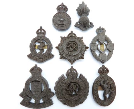Eight British Army Corps economy plastic cap badges including R.E.M.E. Army Service Corps etc