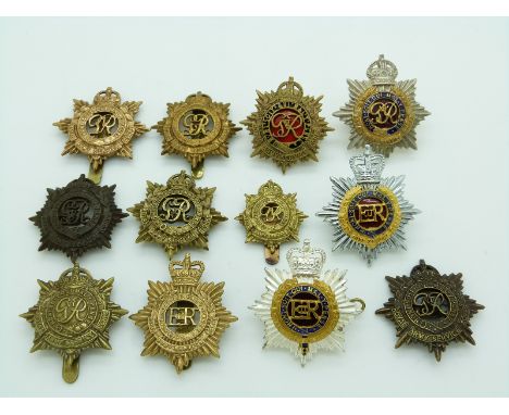 Twelve British Army Royal Army Service Corps metal badges including officer's enamel and a non voided example