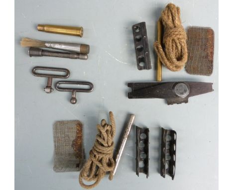 A collection of Lee Enfield rifle accessories including ammunition clips, cleaning kit etc.&nbsp;