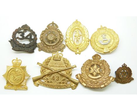 Eight Australian Army including The Adelaide Rifles, Illawarra Regiment and Macquarie Regiment metal hat badges and one colla