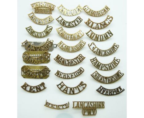 British Army a small collection of County Regiments metal shoulder titles including those for the Glamorgan Regiment, Gloster