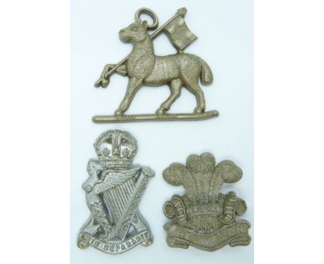 Three British Army Royal Ulster Rifles Regiment, Welsh Regiment and Queen's Regiment economy plastic cap badges
