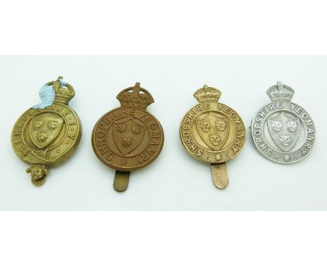 Four British Army Shropshire Yeomanry metal cap badges including a silver example marked TLM