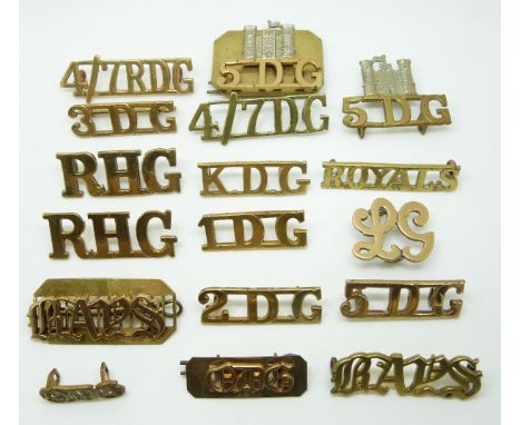 Seventeen British Army Cavalry metal shoulder titles including those for the 1st, 2nd, 3rd and 5th Dragoon Guards, Royal Hors