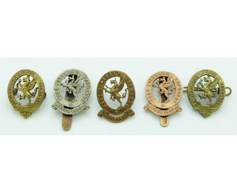 Four British Army West Somerset Imperial Yeomanry metal cap badges