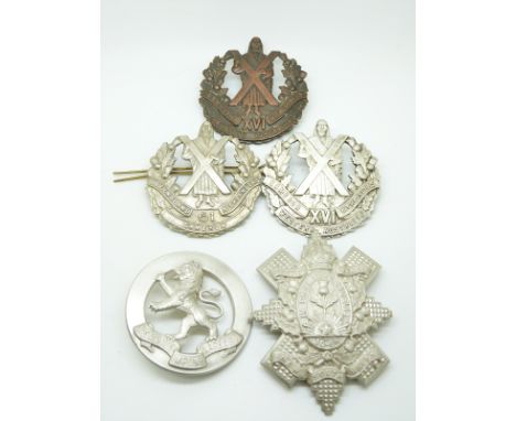 Five Australian Army Scottish metal cap badges for the Cameron Highlanders (2), Queensland Highlanders, New South Wales and V