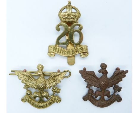 Three British Army 26th Hussars metal cap badges including an officer's example