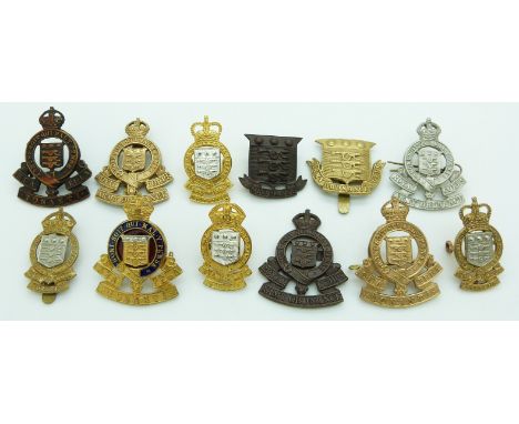 Thirteen British Army Royal Army Ordnance Corps metal badges including officer's enamel and gilt example