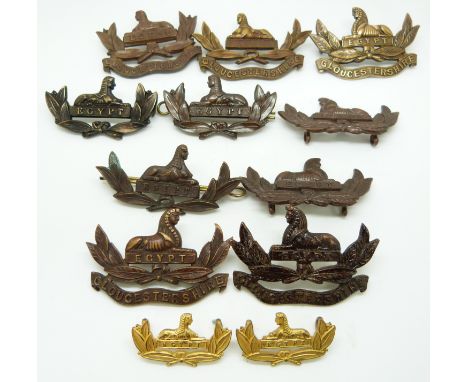 Twelve British Army Gloucestershire Regiment metal collar badges including a brass example and one with vacant plinth&nbsp;