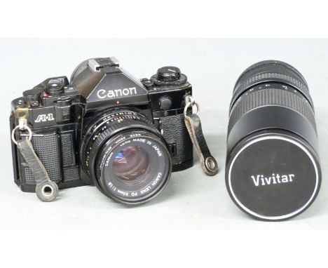 Canon A-1 SLR camera with 50mm 1:1.8 lens and Vivitar 100-300mm 1:5 lens