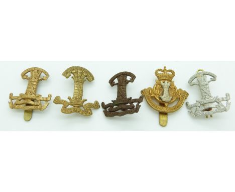 Five British Army Leicestershire Yeomanry metal cap badges including a Leicestershire and Derbyshire example