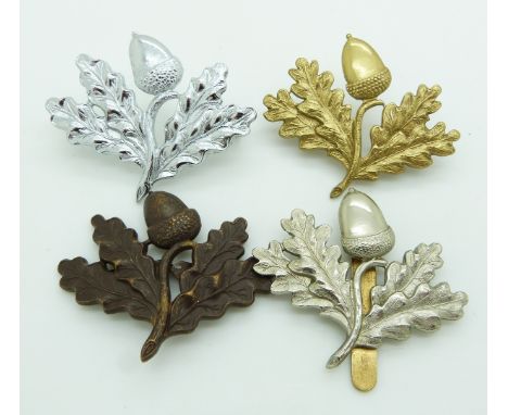 Four British Army South Notts Hussars Yeomanry metal cap badges, one example by Gaunt