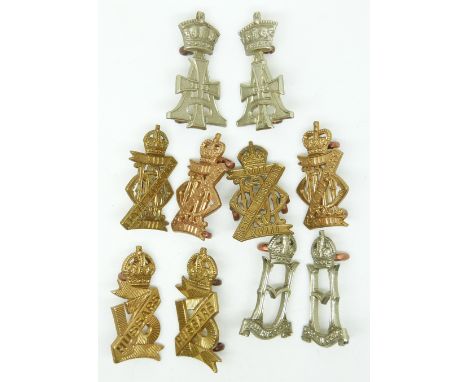 Ten British Army Hussars metal collar badges in pairs for the 13th, 19th, 23rd and 28th (2 pairs) regiments.&nbsp;
