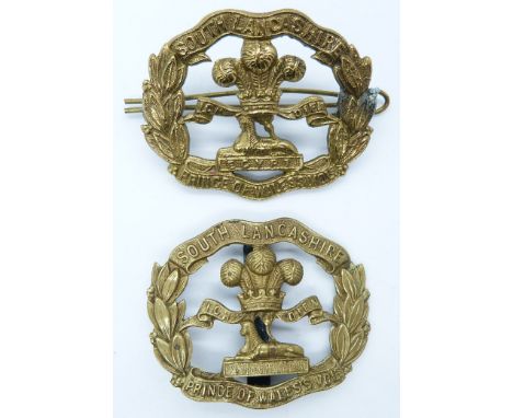 British Army South Lancashire Regiment Prince of Wales Volunteers metal cap badge together with a similar all brass example