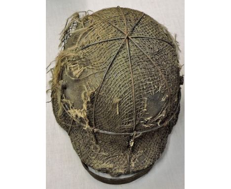 German WWI Stalhelm helmet with hessian cover, still has its original in-liner and chin strap. Fair condition