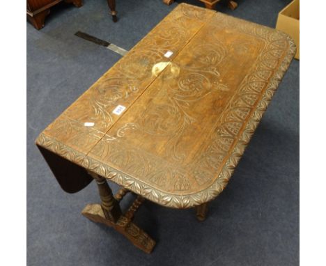 A carved hardwood commode and a carved oak drop flap table (2).