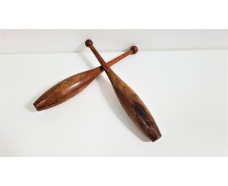 PAIR OF VINTAGE WOODEN EXERCISE CLUBSof tapering form, 45cm high (2) 