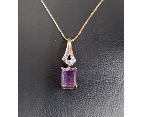 AMETHYST AND DIAMOND PENDANTthe rectangular step cut amethyst drop below diamond set pierced mount, in nine carat gold and on