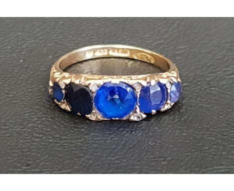 BLUE GLASS SET RINGon eighteen carat gold shank, ring size M-N and approximately 3.4 grams 