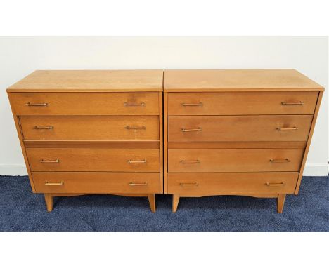 PAIR OF LEBUS LIGHT OAK CHESTS OF DRAWERSwith moulded tops above four long drawers, standing on shaped supports, 79cm wide 