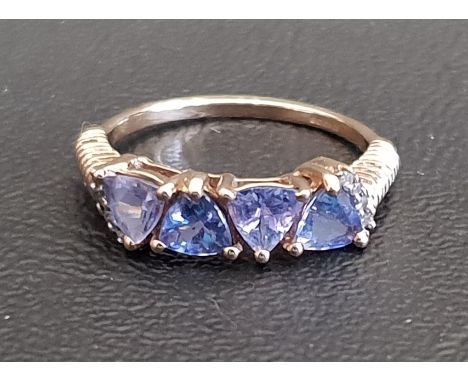 TANZANITE FOUR STONE RINGthe four trillion cut tanzanites on nine carat gold shank with ribbed shoulders, ring size N-O 