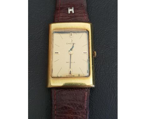 1970s OMEGA DE VILLE WRISTWATCHthe rectangular champagne dial with baton markers, with a manual wind movement, on a brown lea