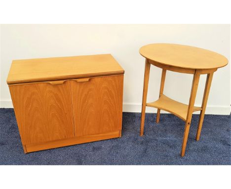 UNIFLEX TEAK SIDE CABINETwith a moulded top above a pair of cupboard doors with roll over handles, standing on a plinth base 