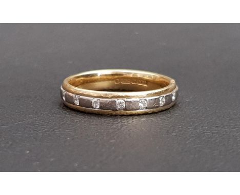 DIAMOND SET EIGHTEEN CARAT GOLD RINGthe seven diamonds flush set in the two tone gold band, ring size N and approximately 4.3