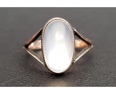 MOONSTONE SINGE STONE RINGthe oval cabochon moonstone on nine carat gold shank with decorative split shoulders, ring size M 