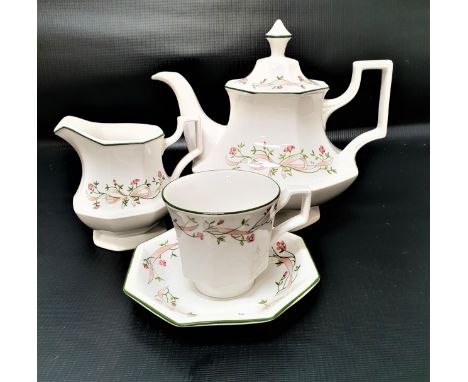 JOHNSON BROTHERS BACHELOR'S TEA SERVICEwith a white ground and floral border with a green rim, comprising two cups and saucer