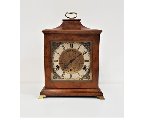 WALNUT BRACKET CLOCKwith a brass dial and silvered chapter ring with Roman numerals and a Westminster chime eight day movemen