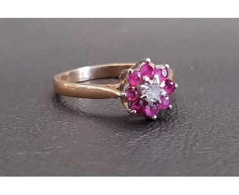 RUBY AND DIAMOND CLUSTER RINGthe central diamond in eight ruby surround, on nine carat gold shank, ring size N 